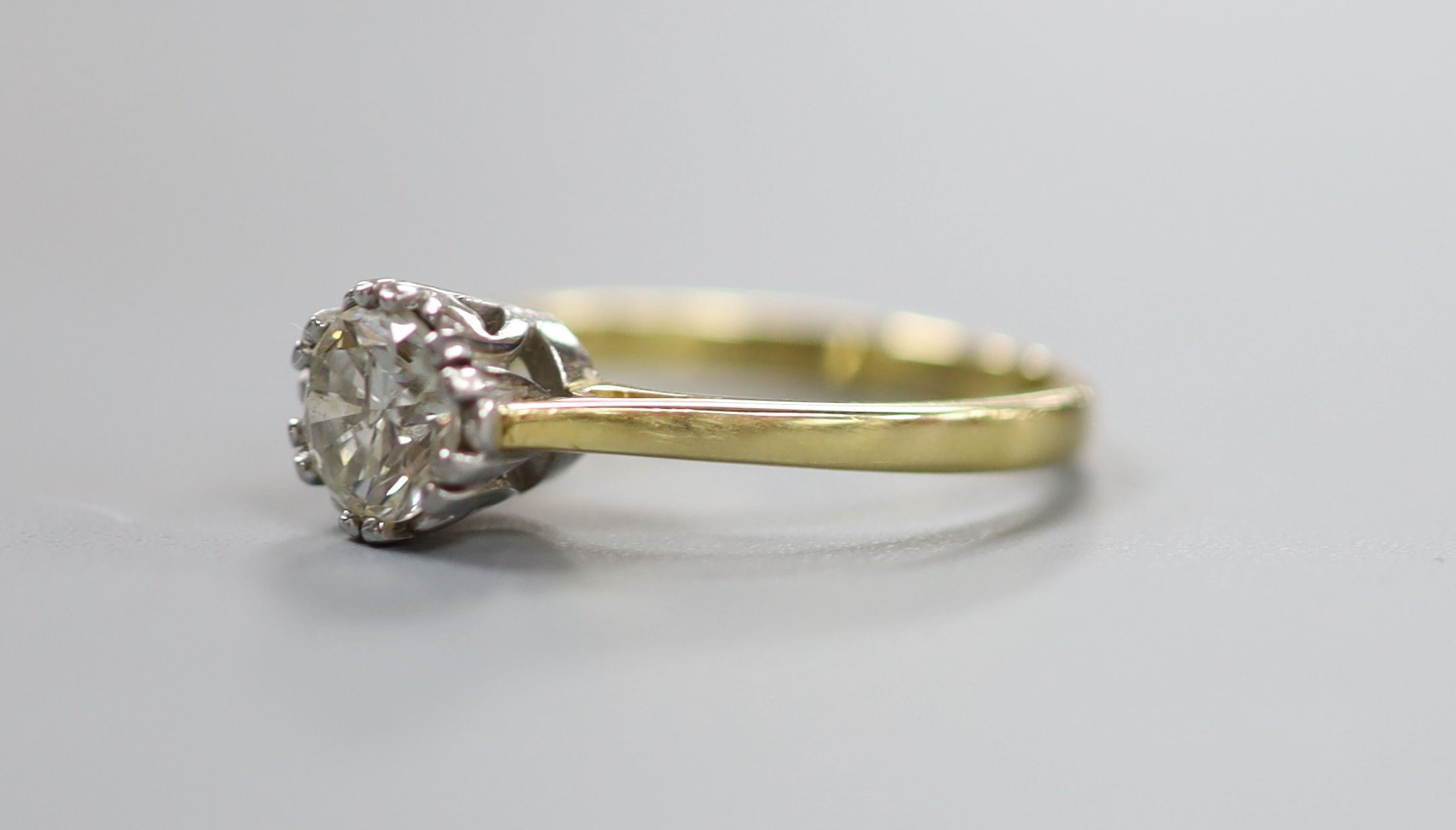 A modern 18ct gold and solitaire diamond ring, the stone weighing approx. 1.03ct, size O, gross weight 4.3 grams.